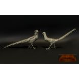 A Pair Of Spelter Figures In The Form Of Oriental Pheasants Silver tone bird figures,