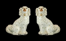 Large Pair of Staffordshire Poodles of typical form with chain and padlock, Molded decoration.