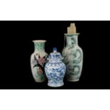 A Large Oriental Vase With Coiled Serpent Design Waisted baluster form vase in white glaze,