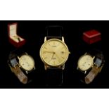 Citizen Gold Gents Slim 9ct Gold Cased Date-Just Wrist Watch with Attached Leather Strap.