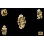 Japanese Superb Quality - Novelty Carved Ivory Netsuke Skeleton Figure with Hand to Head In a