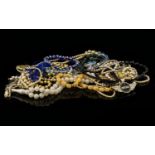 A Mixed Collection Of Costume Jewellery To include several strand of faux pearls, beads, glass