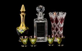 A Ruby Red Venetian Style Decanter and Glass Set comprising decanter and four glasses.