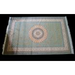 A Large Woven Silk Carpet Abusson rug with green ground and with traditional floral and foliate