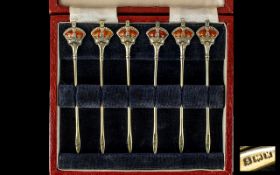 A Nice Quality Cased Set of Six Silver and Enamel Cocktail Sticks.