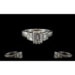 Ladies Platinum - Attractive Contemporary Designed Emerald Cut Diamond Set Dress Ring, The Central
