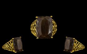 Golden Lustre Sapphire Statement Ring, a 22ct elongated cushion cut solitaire of the rare variety,