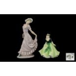 Royal Worcester 'Holly' Figurine dated 2005, 7" tall, depicting a young lady in a pale green dress,