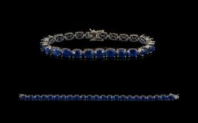 Sapphire Tennis Bracelet, 42cts of sapphires, comprising twenty three oval cut stones in a single