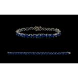 Sapphire Tennis Bracelet, 42cts of sapphires, comprising twenty three oval cut stones in a single