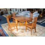 A 1970'S Drop Leaf Table And Four Chairs Of typical form, table when folded 36 x 12 inches, 28