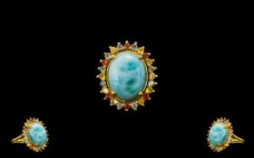 Larimar and Green, Yellow and Sunset Sapphire Ring, a 10ct cabochon of the natural, opaque,