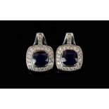 Sapphire and Natural White Zircon Drop Earrings, with ruby accents; each earring comprising a square