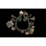 A Nice Quality Vintage Silver Bracelet Loaded with 15 Silver Charms.