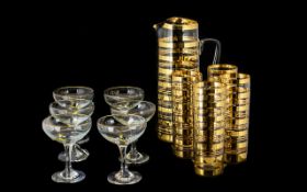 A 1950's Glass Lemonade Set comprising of a large jug and four tall tumblers.