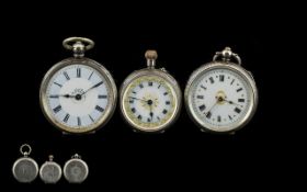 Three Continental Silver Ladies Fob Watches, all with enamel dials and Roman Numerals.