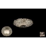 A Victorian Silver Embossed Dish floral embossed decoration, hallmarked for London U 1895.