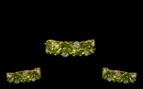 Peridot and Opal Band Ring, five marquise cut peridots, set on the diagonal,