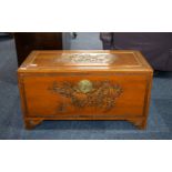 Camphor Chest, Oriental carved lid and sides depicting fighting warrior scenes.