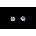 Moonstone Pair of Stud Earrings, each earring having a round cut rainbow moonstone solitaire,