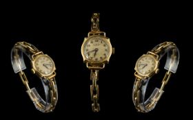 Swiss Ladies Early 20th Century 9ct Gold Cased Mechanical Wrist Watch with Jeweled Movement.