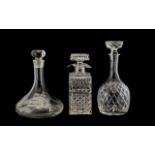 Thee Cut Glass Decanters to include a square decanter 9.