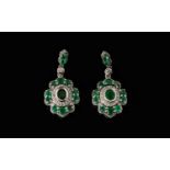 Emerald and Zircon Drop Earrings, each pendant drop having an oval cut emerald, bezel set, initially