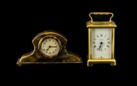 A Modern Brass Carriage Clock of typical form 8 day spring driven movement, white dial.