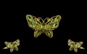 Peridot Butterfly Ring, the millgrain frame of the butterfly set with oval,