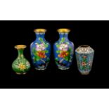 Four Assorted Cloisonne Vases, including a pair of vases decorated in blossom foliage decoration.