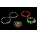 A Collection of Bracelets to include two continental silver bangles engraved with dragons,
