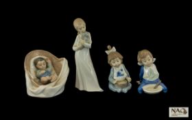 Nao by Lladro Figures ( 4 ) Four In Total. Comprises 1/ Little Baby Boy, Sleeping In a Large Basket.