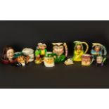 A Collection of Assorted Toby Jugs to include Sylvac hand painted Maid Marian 6" tall;