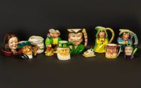 A Collection of Assorted Toby Jugs to include Sylvac hand painted Maid Marian 6" tall;