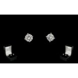 A Pair Of 18ct White Gold Diamond Stud Earrings Each set with a round modern brilliant cut