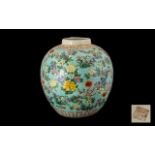 A Globular Shaped Oriental Vase powder blue ground with blossom throughout. height 11 inches.