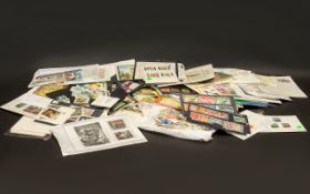 Large Tin of World Stamps - mostly in packets or on cards. Largely as bought or made ready for sale.