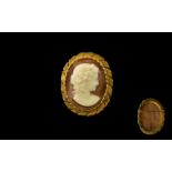 Cameo Brooch in Gold Coloured Metal - oval cameo brooch in gold coloured mount, 2" x 1.75".