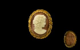 Cameo Brooch in Gold Coloured Metal - oval cameo brooch in gold coloured mount, 2" x 1.75".