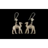 A Pair of Egyptian Silver Heavy Earrings in the form of camels. Each camel measuring 2.5 by 2 cms.