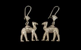 A Pair of Egyptian Silver Heavy Earrings in the form of camels. Each camel measuring 2.5 by 2 cms.