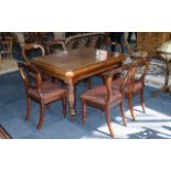 Victorian Extending Table in mahogany, with two wind-out leaves, and six balloon back chairs.