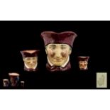 Three Royal Doulton Toby Jugs 'The Cardinal' comprising large Toby Jug 7" tall;