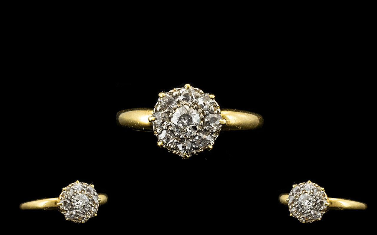 18ct Gold Diamond Set Cluster Ring of pleasing design from the 1920's. Flowerhead design excellent