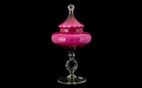 A Contemporary Glass Centrepiece Lidded dish with transparent circular base, twist stem and pink