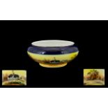 Noritake Bowl decorated with an Oasis scene with Ostriches. Thick royal blue band to rim.