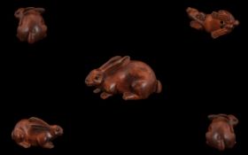 Japanese Late 19th Century Carved Boxwood Netsuke In The Form of a Long Ear Rabbit.