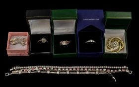A Collection of Jewellery - to include 3 silver rings, 1 Swarovski 3 stone ring, earrings,