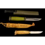Two Hunting Knives. One handmade Swedish knife, and one Swedish Mora 2000.