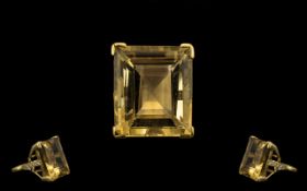 A Superb and Impressive Large Step Cut Topaz Set In a Gold Shank, with Diamond shoulders.